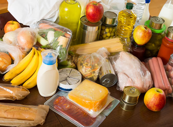 Food provisions including fruit, dairy, canned goods, pasta, and cooking oil
